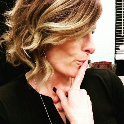 Short stacked bob with wavy hair and an ombre for hair color. This cut and color has a very trendy sexy look to it.