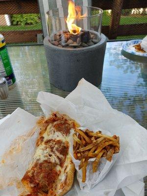 Italian meatball sandwich with provolone and hand cut fries