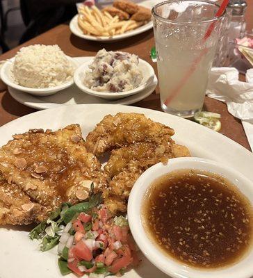 Sesame chicken with rice and mashed potatoes