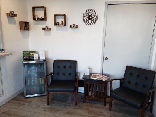 Our completed waiting room for customers. This side has free cold drinks and charging outlets for phones and computers on the side table.