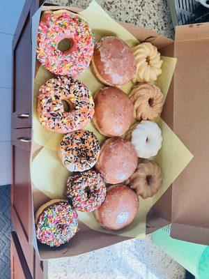 1 dozen mixed crullers, jellies, and glazed with sprinkles.