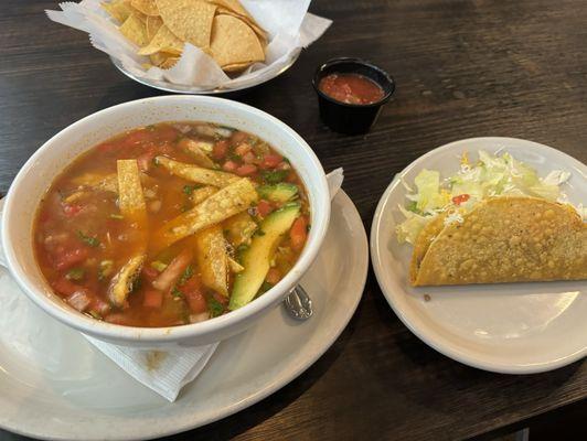 Bowl of chicken Tortilla Soup. Crispy beef taco. Chips and salsa.