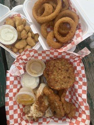 Friday Fish Fry with baked and fried cod, coleslaw, potato pancake with apple sauce, fried cheese curds and onion rings