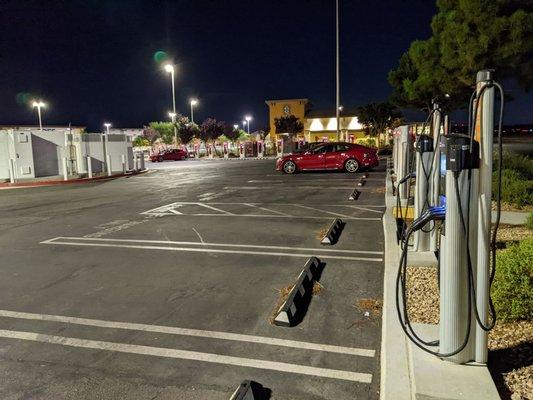 20 Tesla superchargers next to charge point charger for your cell phones