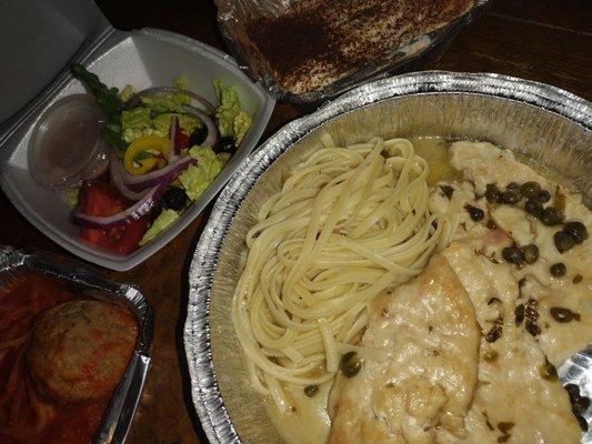 Chicken piccata, house salad, spaghetti with one meatball, and tiramisu