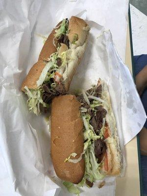 Steak and cheese grinder with lettuce and tomato