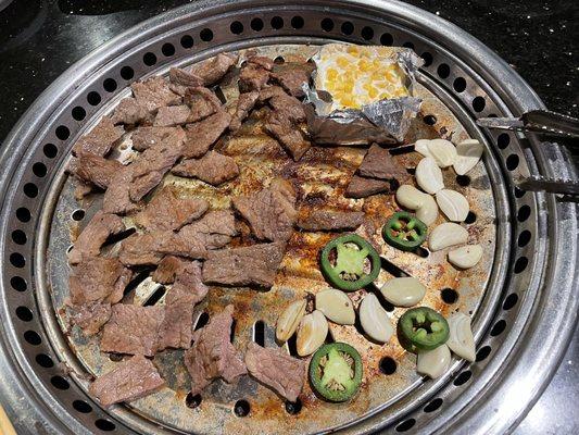 Marinated beef galbi with sliced jalapeño, garlic and cheese corn