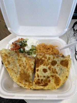 Carnitas quesadilla with beans, side of delicious Spanish Rice , Pico de gallo, Sour Cream and Fresh Guacamole Dip.