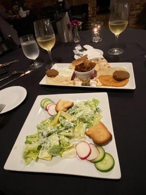 Mezza appetizer, Caesar salad, and white wine.