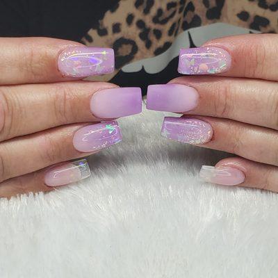 Medium length purple and pink pastel ombre with glitter encapsulation.