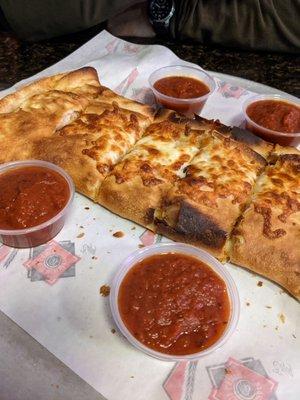 Large calzones with tons of marinara sauce