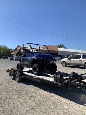 Loading her out on my car trailer at Kirby's SuperSports after purchasing it for the trip home.