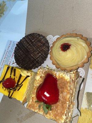 Mango mouse, chocolate tart, raspberry lemon tart & I forgot the name of the last one lol.