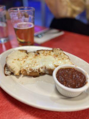 Cheesy bread with tomato sauce