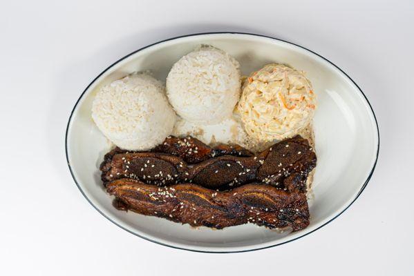 Calbi Ribs Plate at Dalu Hawaiian BBQ! Succulent ribs marinated in our signature Hawaii-inspired sauce, served with macaroni salad and rice