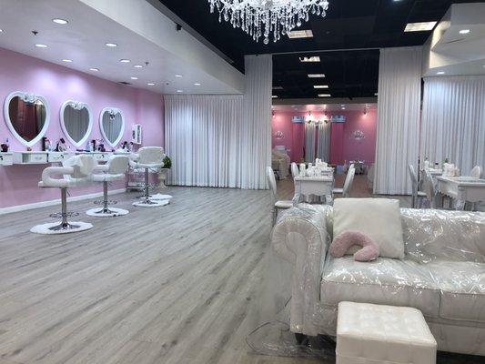 Hair station on left, pedis are done on the couches & manis on the tables behind them.