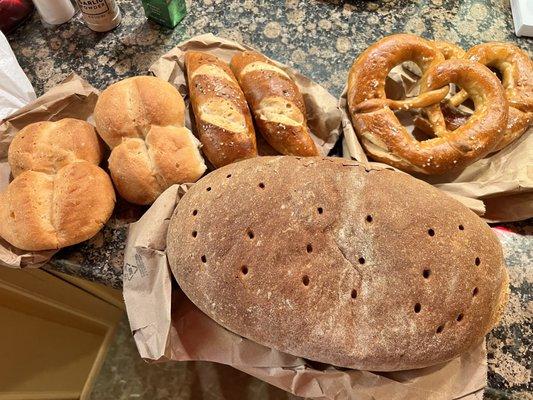 Rolls, pretzels, and loaf of light rye bread