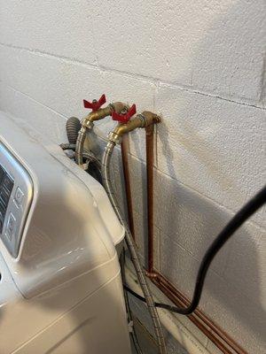 They moved the pipes and spigots closer to the washing machine.