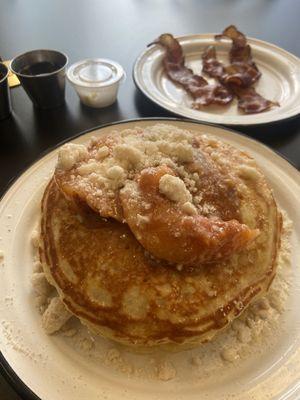 Peach Cobbler Pancakes with a side of bacon.