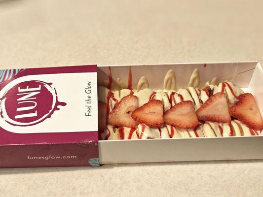 Strawberry Mini Pancakes - drizzled with white chocolate and strawberry sauce, topped with sliced strawberries