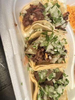 Taco platter - barbacoa, carne asada and lengua with rice and beans