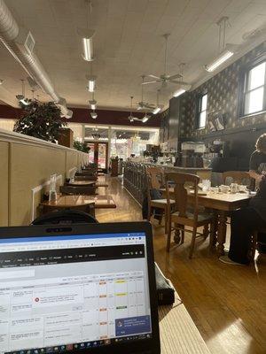 Partial view of dining area and counter seating.