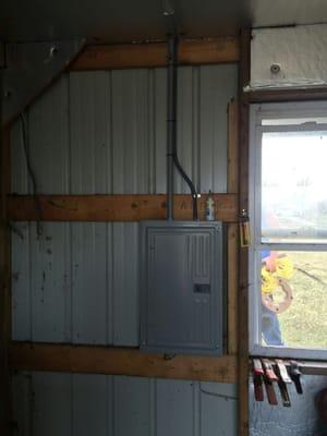 Electrical power and service panel in a customer's detached garage