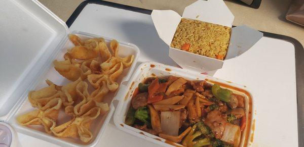 Szechuan chicken with crab rangoons and fried rice.