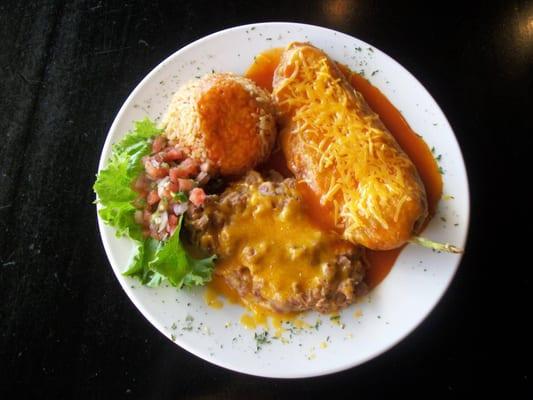 Chile Relleno
 Breaded and pan fried green chili stuffed with cheeses, comes with re-fried beans, pico de gallo, and mexican rice.