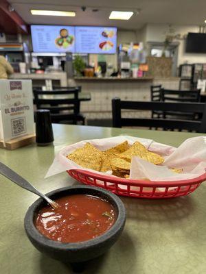 Dine in free chips and spicy salsa on the table