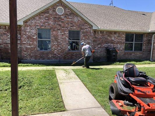 My guys are edging and weeding out the flowerbeds and along the sidewalks before mowing