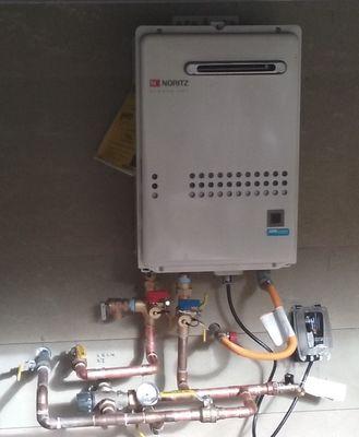 Noritz tankless water heater with solar thermal preheated water