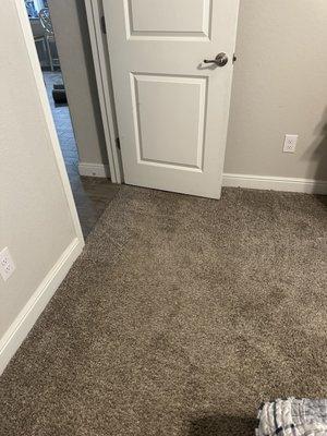 After repair - He used the carpet material I provided from builder.