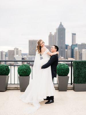 Wedding hair stayed out even on a windy rooftop!