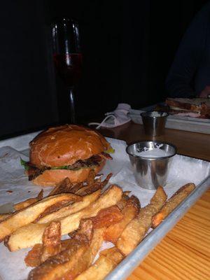 Tasty Burger with Bacon, fries, and a Pomegranate Bellini