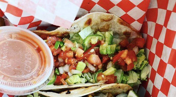 GRIDLOCK - Beef skirt steak taco, garnished with spicy avocado pico de gallo