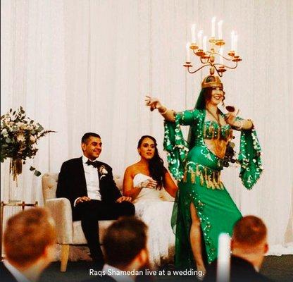 Performing raqs shamedan (candelabra dance) at an Egyptian wedding.