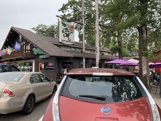 The main sign, front door, and side patio, plus the walk down to Adirondack coffee.