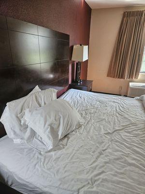 The bed and bed frame in all its stained glory. Sadly, the light doesn't hit right on the bedding stains properly