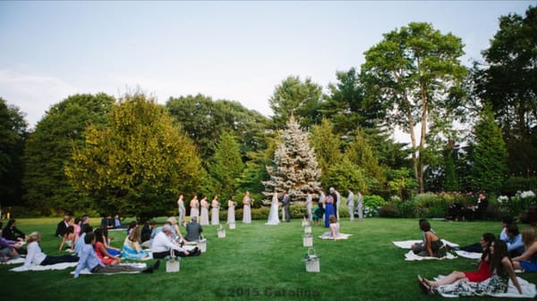 Our guest sat on blankets during our ceremony to give it a garden wedding feel.