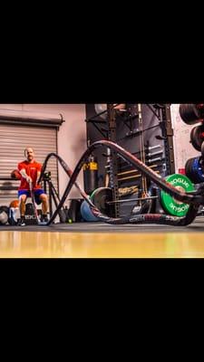 Personal trainer Ben working out with battle ropes