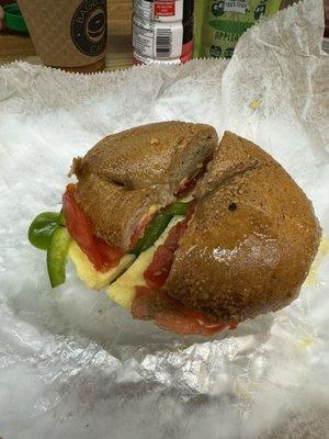 Veggie and egg on honey wheat bagel.