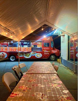 Indulge in authentic Mexican cuisine at our inviting food truck, tucked away in the corner for a cozy dining experience.