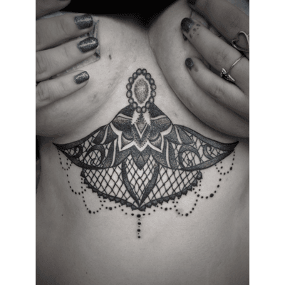 Custom underboob tattoo that Cole custom designed and tattooed her at the shop