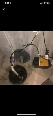 A new battery powered back up sump pump. This homeowner will not have to worry about a flooded basement again.