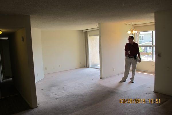 Surveying living room to add partition and create 25 additional bedrooms to the complex. Job currently in progress.