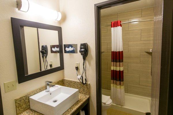 NEW MODERN STANDING BATH TUB WITH NEW VESSEL SINK VANITY.