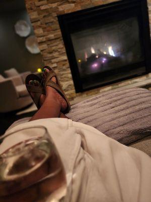 The quiet room in front of the fireplace with citrus water.