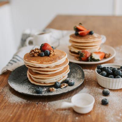 A Close-Up Shot of Pancakes with Strawberries and Blueberries