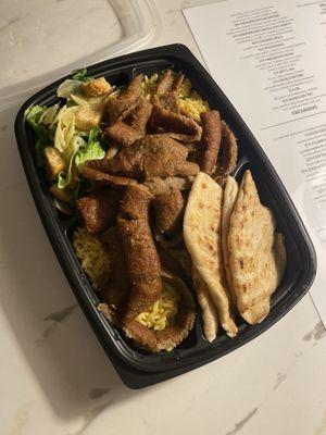 Gyro Platter with Cesar Salad, Yellow Rice and White Pita. Not pictured is the Tzatziki sauce and Cesar Dressing